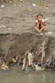 /album/our-impact/boy-sits-in-filth-lovina-beach-bali-jpg/